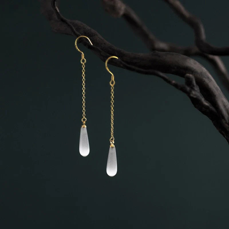 925 Sterling Silver Opal Drop Earrings with a sleek and sophisticated design, perfect for adding a touch of elegance to any outfit.