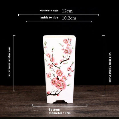 Elegant square ceramic planter in white with a Chinese-inspired design, suitable for indoor plants like asparagus fern and orchid.
