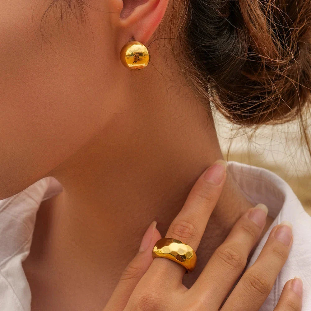 Elegant 18K gold-plated cutout earrings with a sleek hemispherical design, perfect for formal events and everyday wear.