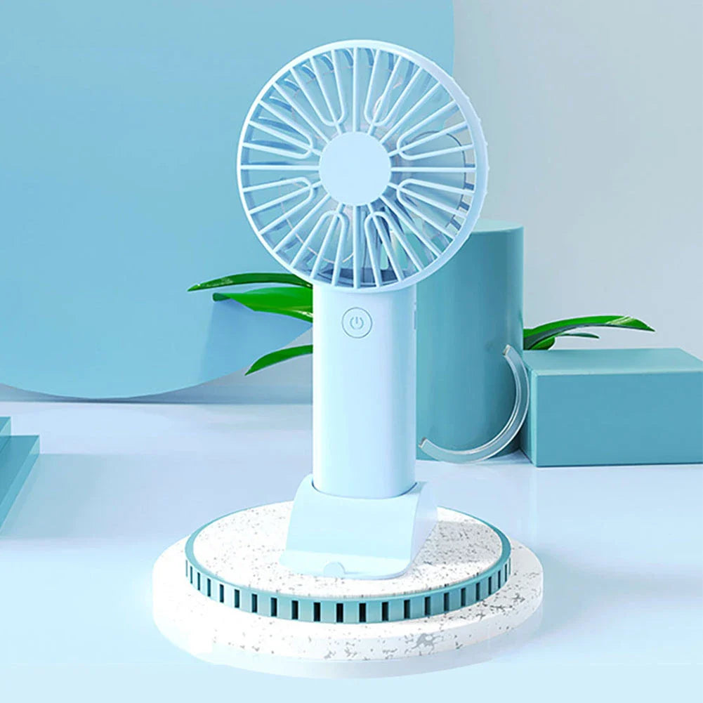 Compact USB Rechargeable Mini Handheld Fan with 3 wind modes, desktop stand, and phone holder for cooling anywhere