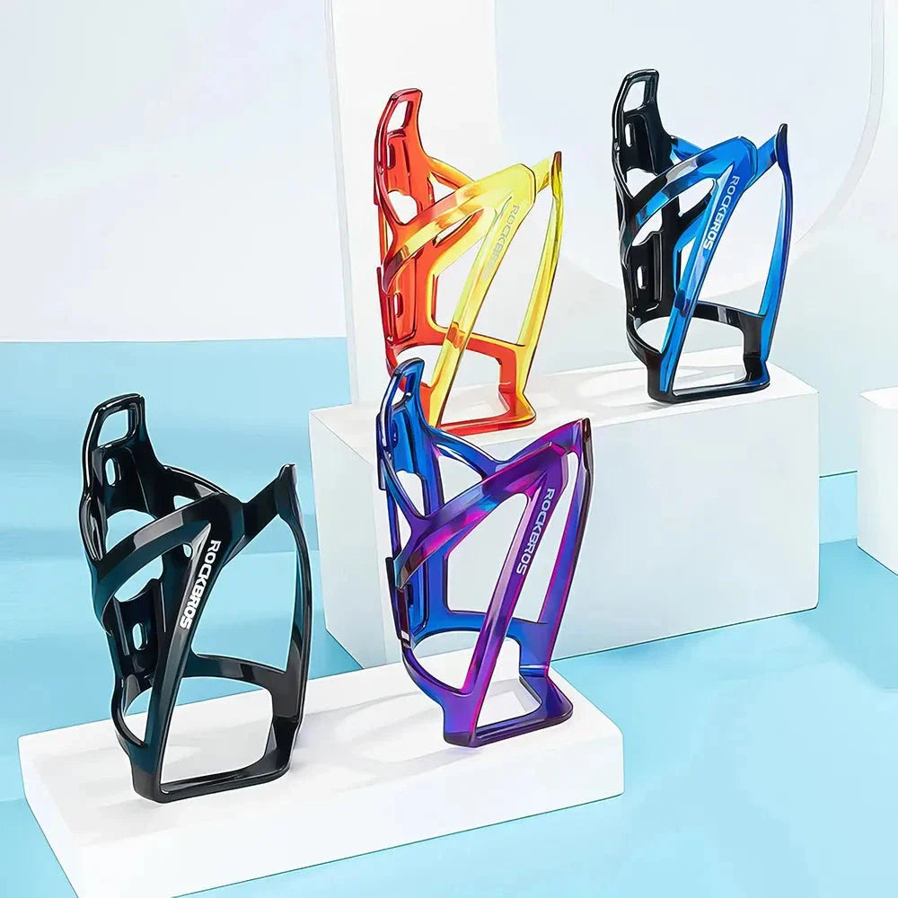 A stylish, lightweight cycling bottle holder with a two-tone design, securely holding a water bottle on a bike.