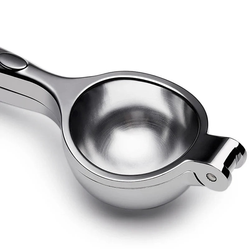Manual citrus juicer made of stainless steel with an ergonomic handle for easy and efficient juice extraction