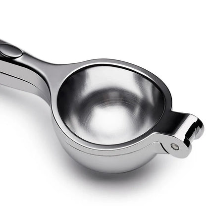 Manual citrus juicer made of stainless steel with an ergonomic handle for easy and efficient juice extraction