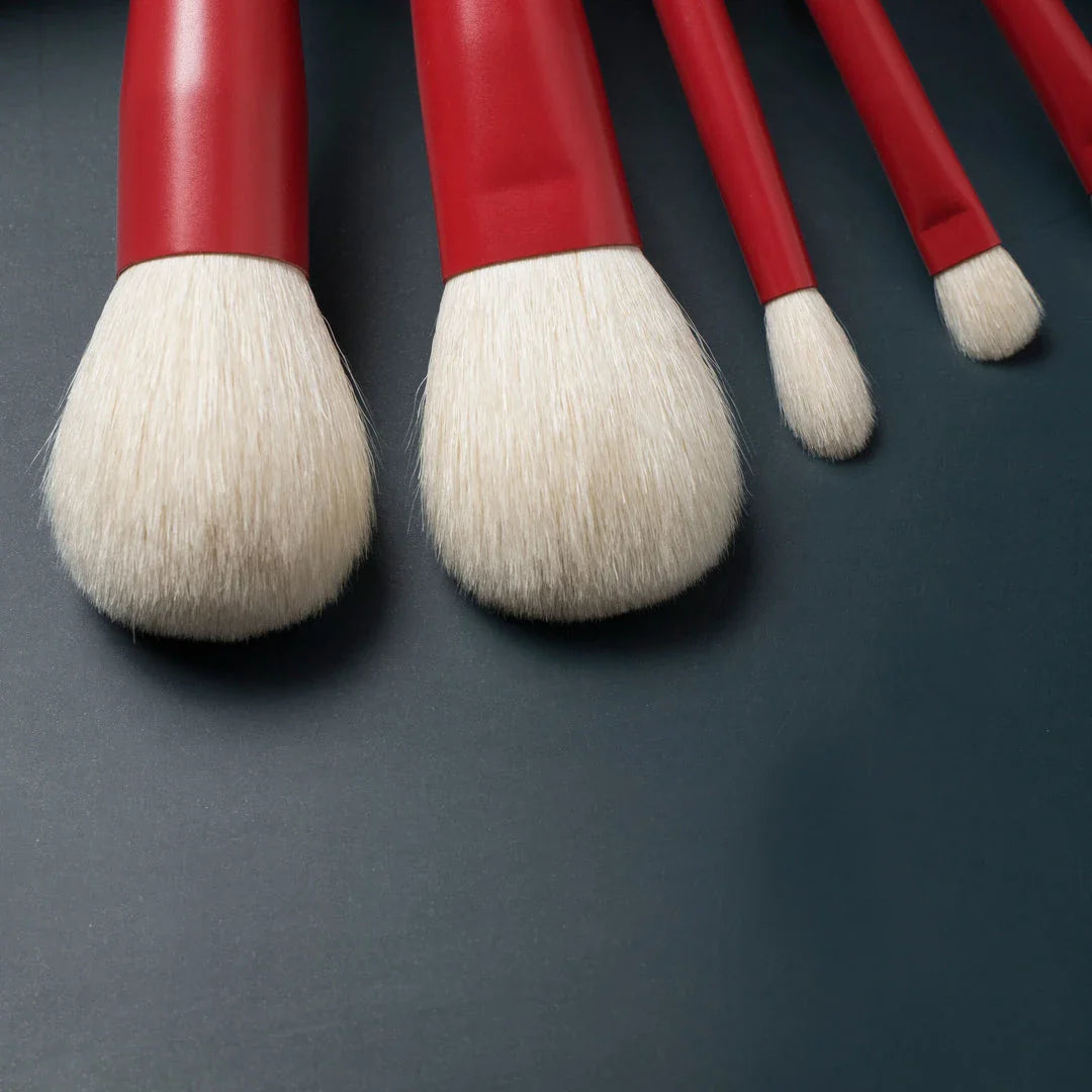 7-piece premium red makeup brush set with goat hair bristles, wooden handles, and aluminum ferrules for flawless powder, eye shadow, and blush application