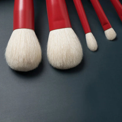 7-piece premium red makeup brush set with goat hair bristles, wooden handles, and aluminum ferrules for flawless powder, eye shadow, and blush application