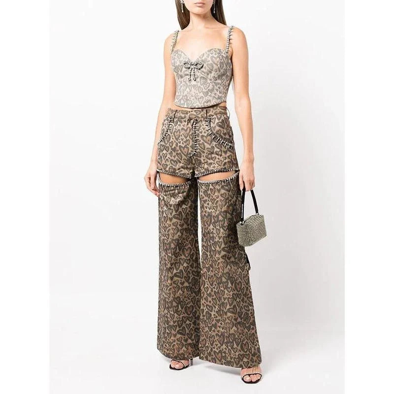 Chic high-waisted patchwork leopard print denim trousers with rivet details and wide-leg silhouette