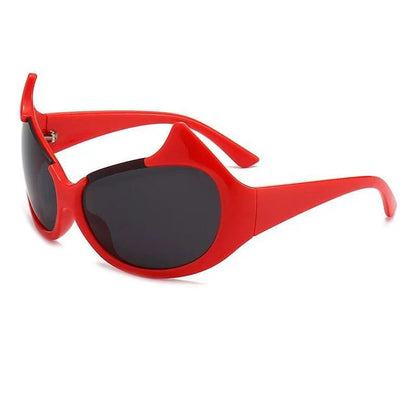 Stylish cat-eye sunglasses with oversized frames, semi-rimless design, and punk-inspired detailing for a timeless, glamorous look