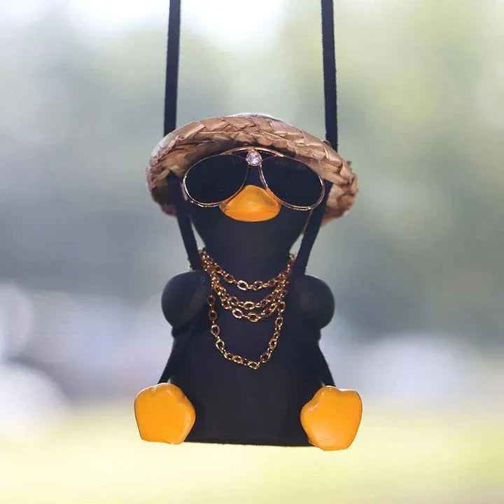 Cute swinging duck car pendant with a guitar and coke-themed design, adding a touch of personality to your vehicle