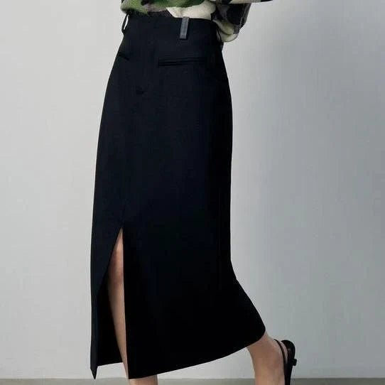 High-waisted slim-fit black midi skirt with metallic decoration, sequin detailing, and split hem