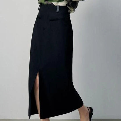 High-waisted slim-fit black midi skirt with metallic decoration, sequin detailing, and split hem