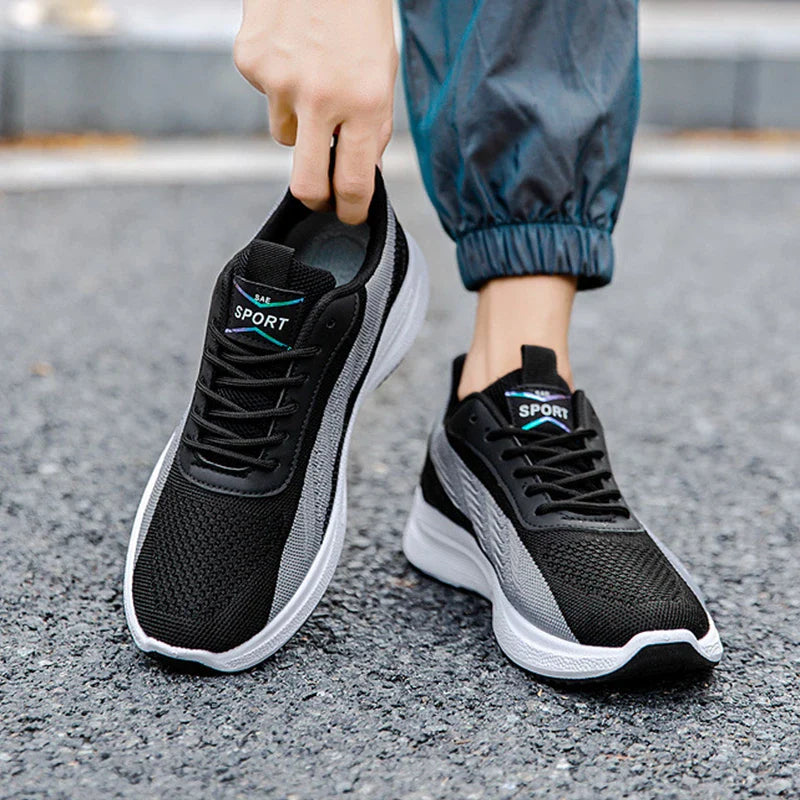Breathable, comfortable color-blocked mesh sneakers for men with a durable rubber sole and secure lace-up closure