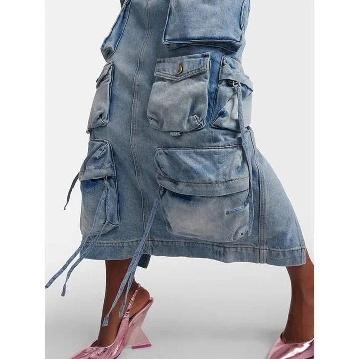 A high-waisted denim skirt with a distressed ribbon slit, perfect for adding a touch of fashionable flair to your spring wardrobe.