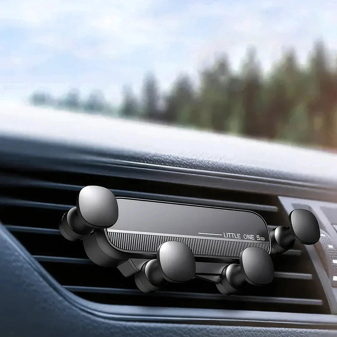 Gravity-powered car phone holder with air vent mount, securely holding a smartphone in place