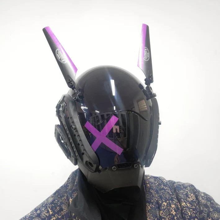 A white face mask with rabbit ears, featuring adjustable elastic straps for a customized fit.