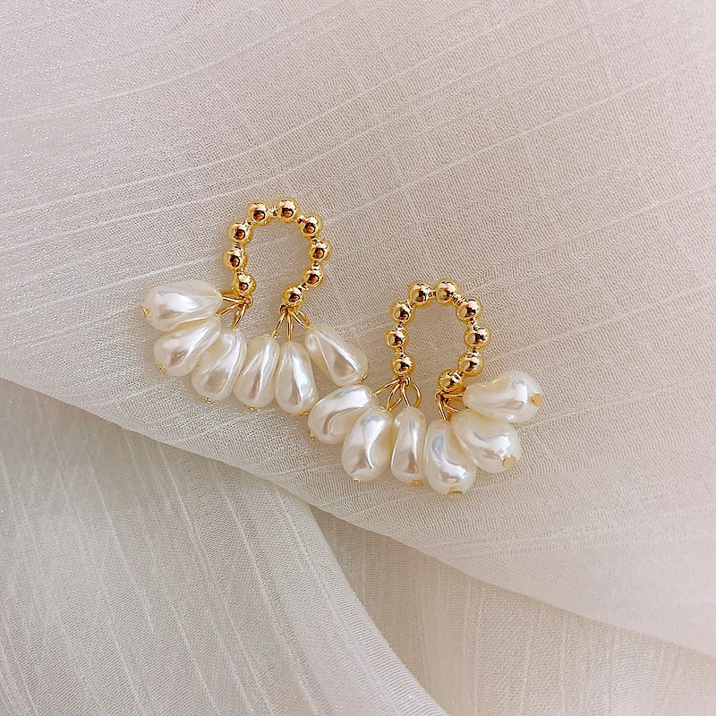 Elegant Baroque pearl earrings with a shimmering alloy, silver, or gold-plated finish
