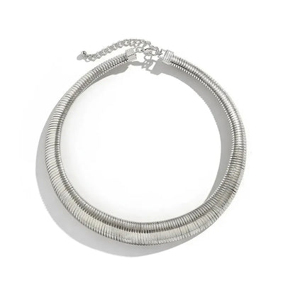 Glamour Spiral Chunky Choker Necklace in silver and gold color options, featuring a hyperbolic geometric design for a bold and captivating look.