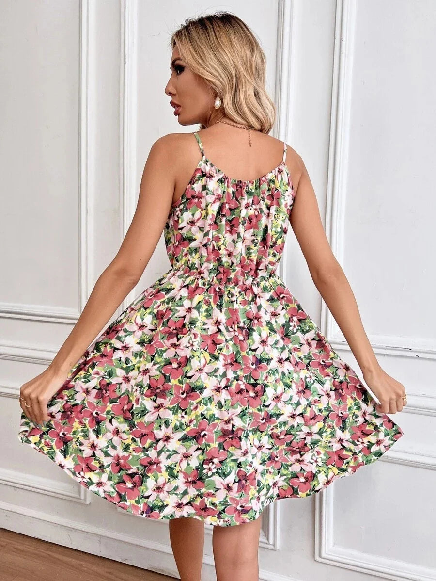 A stylish floral print suspender dress with an elastic waist, perfect for summer fashion and casual or dressy occasions.