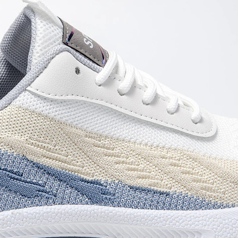 Breathable, comfortable color-blocked mesh sneakers for men with a durable rubber sole and secure lace-up closure