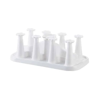 Flower-shaped mug holder rack in white, with 8 slots for organizing and displaying mugs on a kitchen countertop