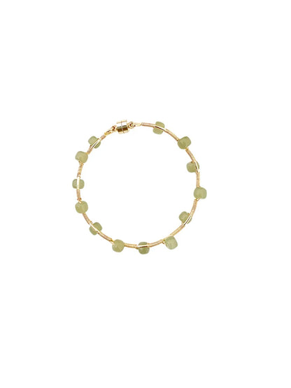 Elegant handcrafted Hetian jade bracelet with a captivating wave pattern, a sophisticated accessory that adds natural beauty to any outfit.