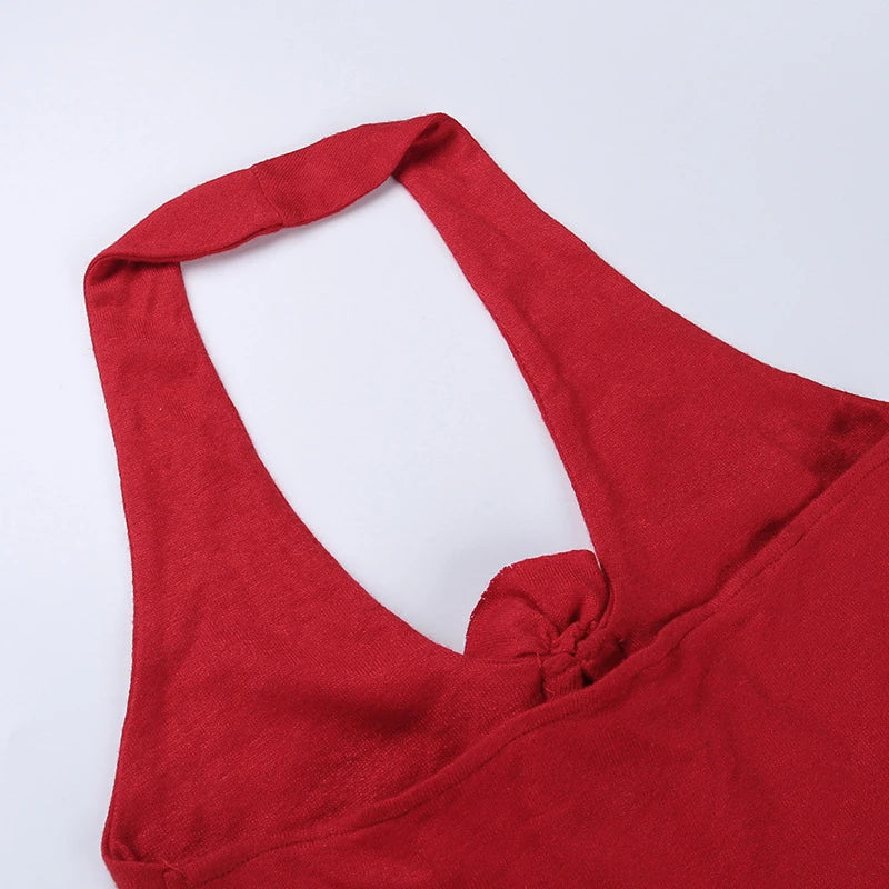 Chic knit halter vest with a captivating 3D floral pattern, delivering a trendy and versatile look for any occasion.