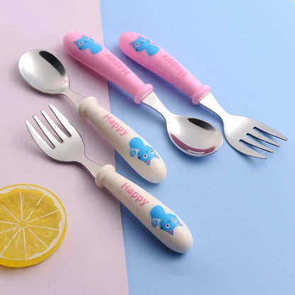 Charming cartoon-designed stainless steel toddler cutlery set with spoon and fork, perfect for mealtimes and self-feeding