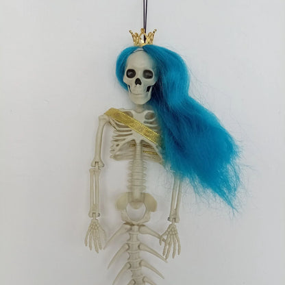 Mermaid bone pendant in various colors, including brown, dark purple, burgundy, and lake blue, hanging outdoors for Halloween decoration