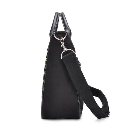 Chic spooky ghost print canvas tote bag with adjustable shoulder strap and zippered closure