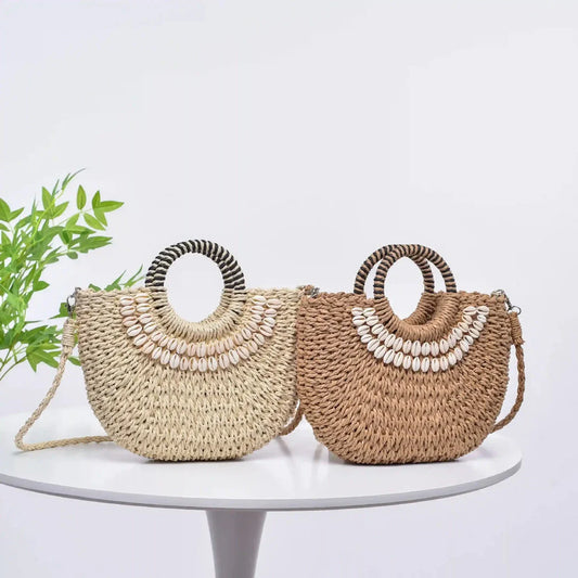 Handmade straw woven crossbody handbag with seashell accents, perfect for summer beach and resort wear