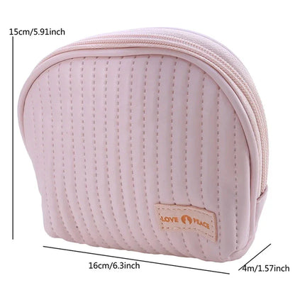 Stylish compact makeup bag made of premium PU leather in light blue color, with a sleek minimalist design for modern women