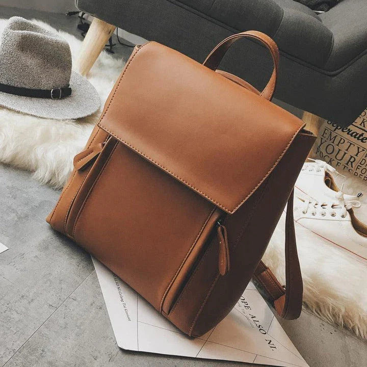 Versatile British-inspired shoulder bag made from high-quality PU leather with a spacious main compartment, convenient pockets, and an adjustable strap