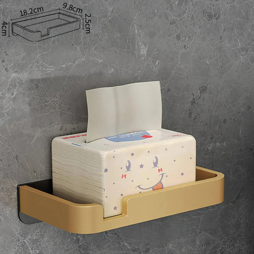 Black and gold aluminum bathroom paper holder with a convenient phone shelf, a stylish and functional accessory for modern bathrooms.