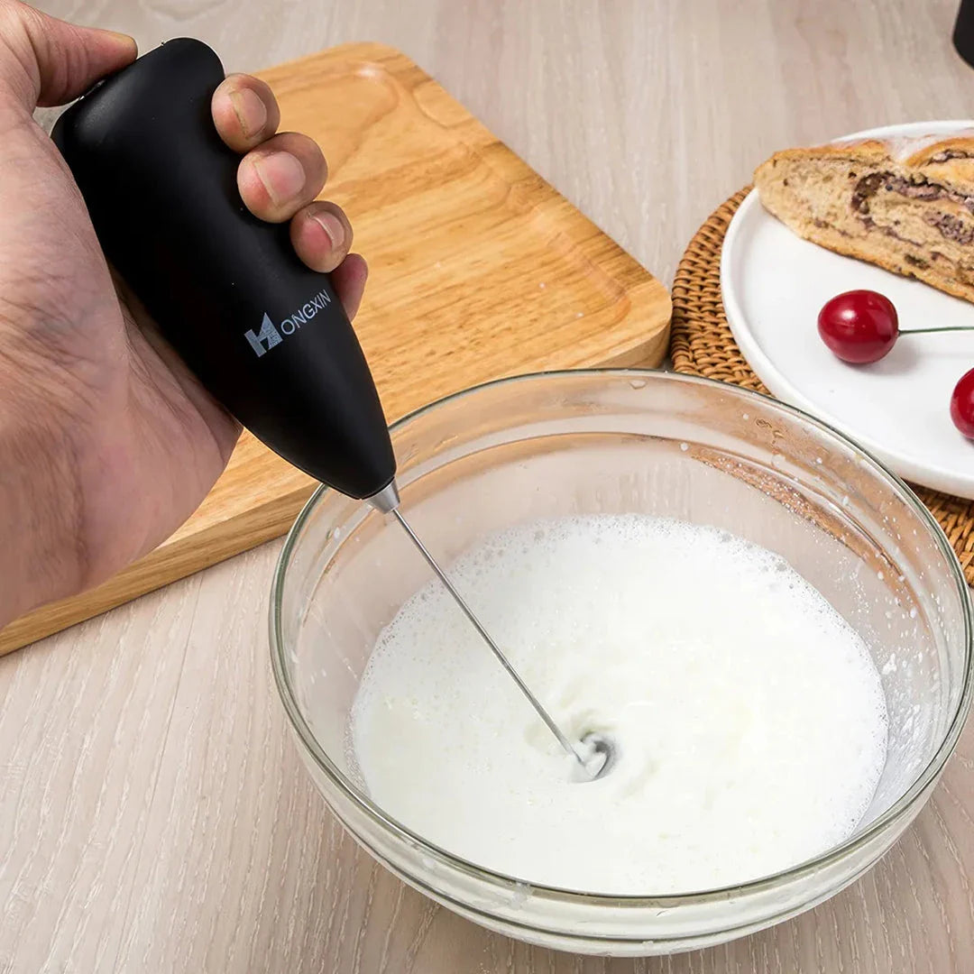 Portable electric milk frother and blender with sleek, ergonomic design and stainless steel mixing head