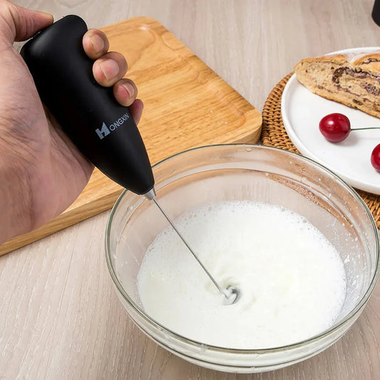 Portable electric milk frother and blender with sleek, ergonomic design and stainless steel mixing head