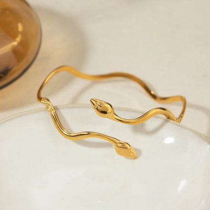 18K gold-plated stainless steel wavy snake bracelet with vintage-inspired design and open cuff style