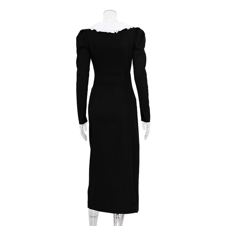 Black and white color-blocked dress with long sleeves and a doll collar, showcasing a timeless and sophisticated style.