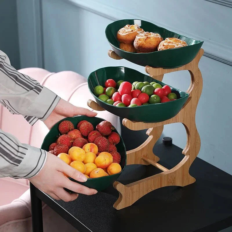 Three-tier plastic and bamboo fruit display tray with unique leaf-shaped design, available in white, beige, and green colors