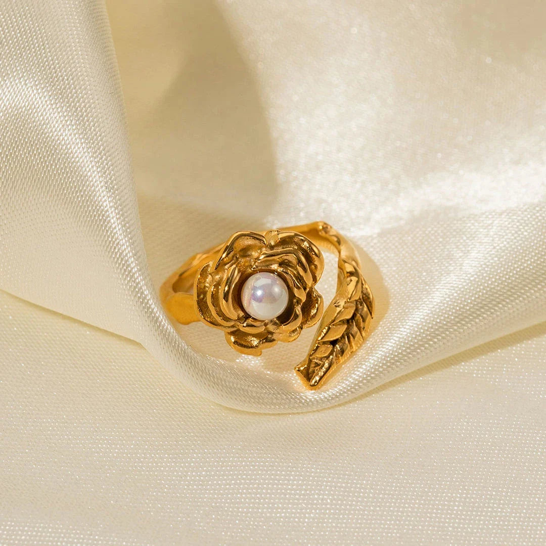 Gold stainless steel camellia ring with shellfish beads, a timeless and elegant accessory for any occasion.