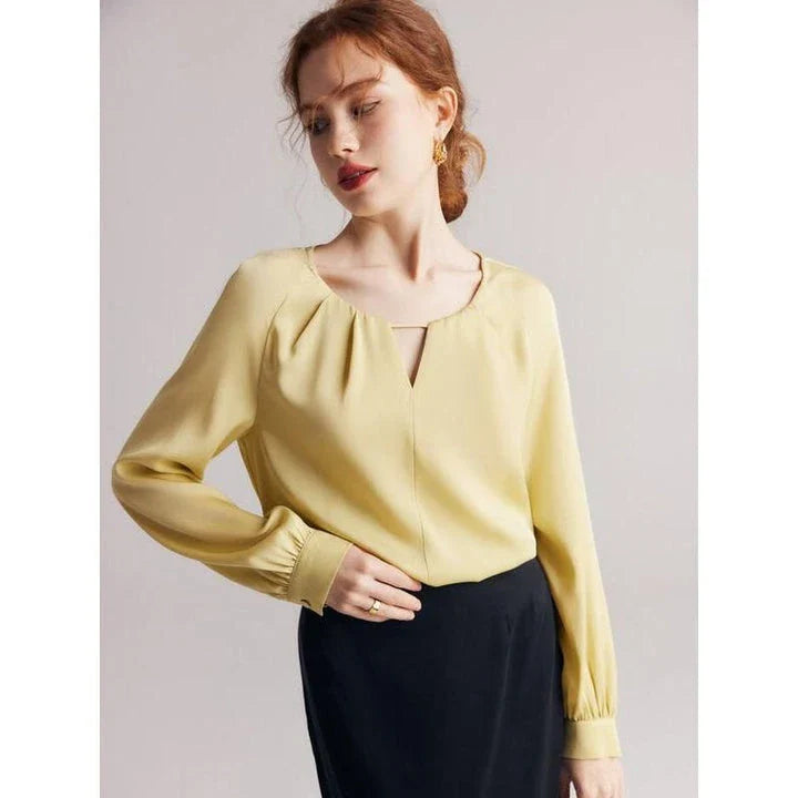 Elegant silk blend raglan sleeve blouse with timeless design and flattering fit for modern women