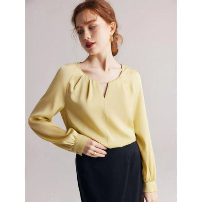 Elegant silk blend raglan sleeve blouse with timeless design and flattering fit for modern women