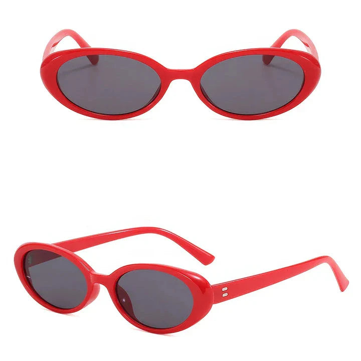Chic oval sunglasses with white grey acetate frames and polycarbonate lenses, designed for fashionable women to shield their eyes from UV rays in style.