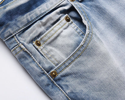 Premium distressed denim jeans with ripped detailing, perfect for casual streetwear style