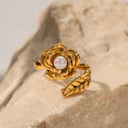 Gold stainless steel camellia ring with shellfish beads, a timeless and elegant accessory for any occasion.