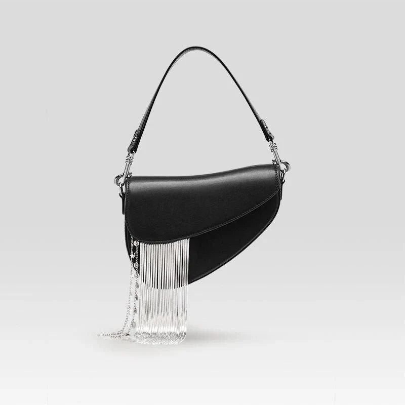 Premium leather crossbody saddle bag with stylish tassel detail, perfect for everyday use or formal occasions.
