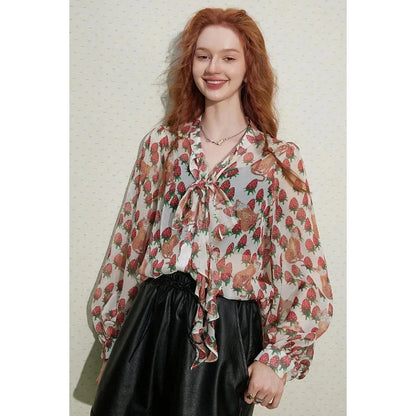 Elegant floral chiffon blouse with lantern sleeves, featuring a vibrant floral pattern and a delicate bow collar