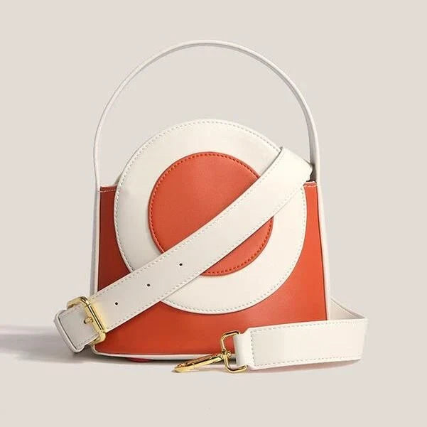 Chic color block vegan leather bucket bag with adjustable strap, perfect for everyday use and special occasions