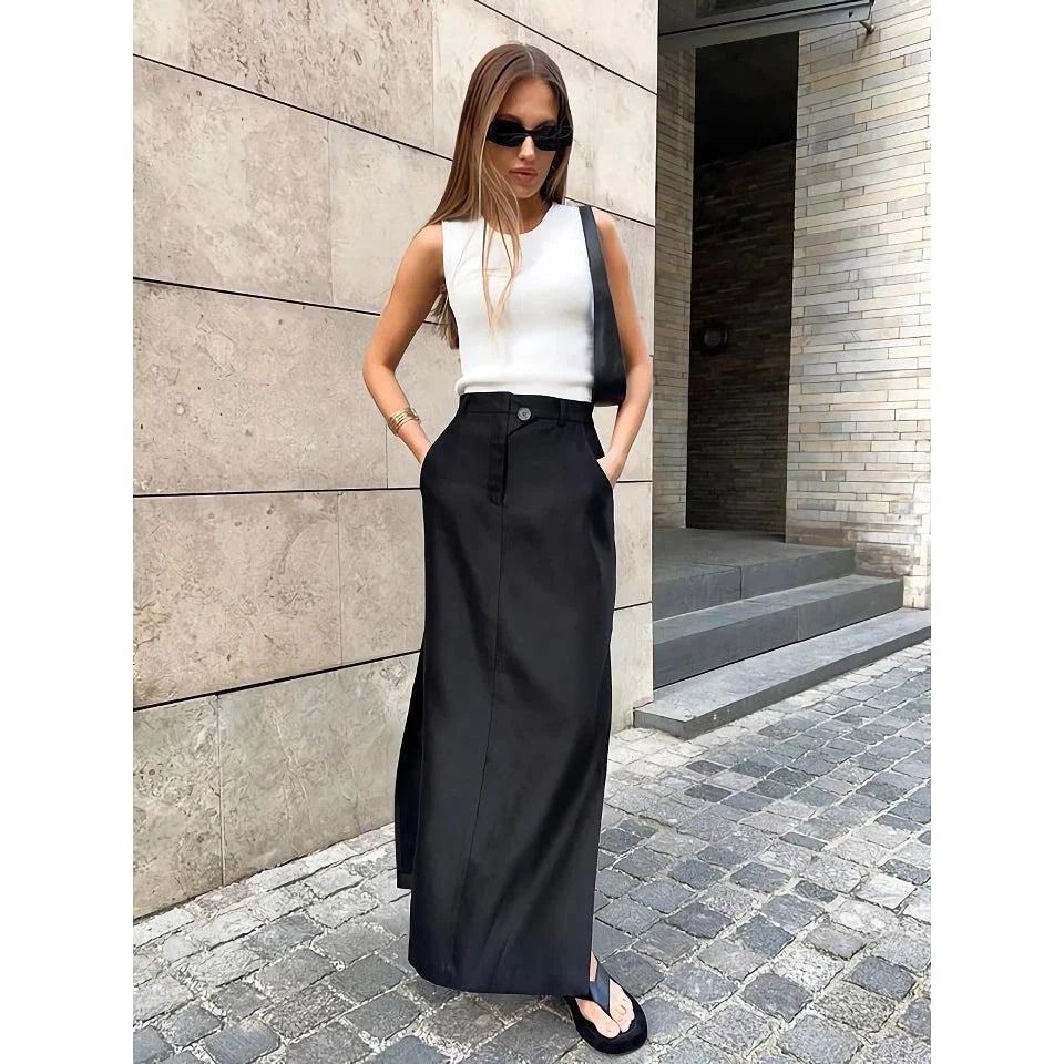 Elegant black ankle-length a-line skirt with pockets, made from a premium blend of polyester, spandex, and viscose for a comfortable, non-stretch fit.