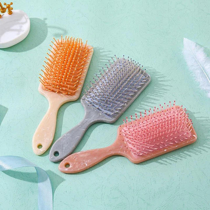 Marble Air Cushion Scalp Massage Hairbrush with air cushion technology for a soothing scalp massage and smooth, frizz-free hair