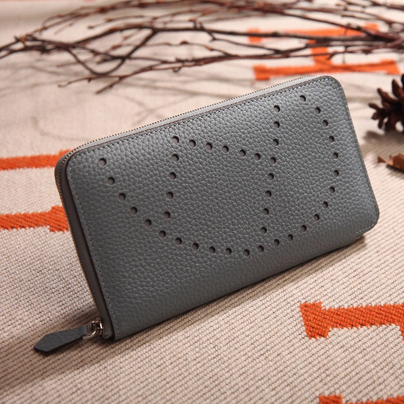 Premium cowhide leather clutch bag with lychee pattern design, featuring a medium-sized square shape and versatile style