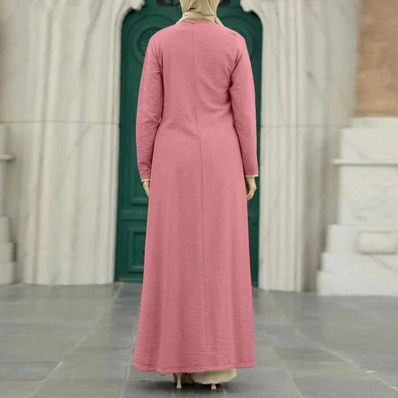 Elegant polyester dress with long sleeves, high slit hem, and available in caramel, black, blue, green, and pink colors